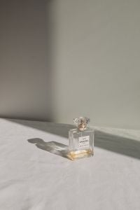 Kaboompics - Chanel No. 5 Perfume Bottle with Window Shadow