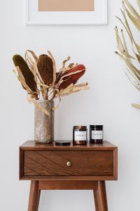 Kaboompics - Abstract Wall Art, Dried Botanicals and Soy Candles Styled on a Walnut Console