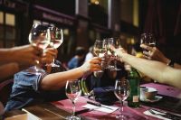 Kaboompics - People holding glasses of white wine making a toast