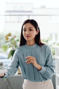 Kaboompics - Asian Woman Receiving a Document from a Colleague