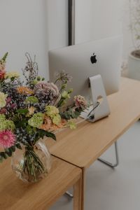 Kaboompics - Close Crop of Bouquet Beside Silver iMac on a Desk