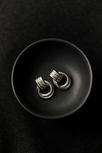 Kaboompics - Silver Earrings in Black Bowl