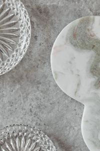 Gray Marble Texture Backgrounds with Crystal Glass Dishes and Neutral Product Styling