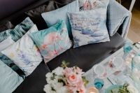 Kaboompics - Patterned Blue Decorative Cushions Arranged on a Gray Living Room Sofa