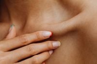 Kaboompics - Close-Up of Manicured Hand Touching Bare Neck and Collarbone in an Asian Beauty Editorial
