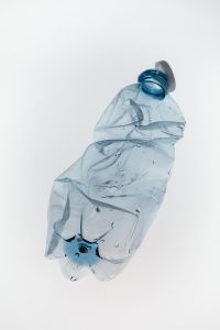 Kaboompics - Plastic Bottle With Open Cap Minimal White Background