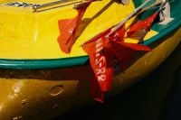 Kaboompics - Red Fishing Flags on Yellow Boat
