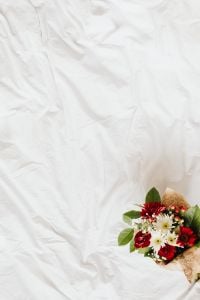 Kaboompics - White Linen Background With Floral Accent and Negative Space