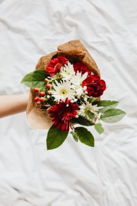 Romantic Flower Bouquets on White Bedding With Copy Space