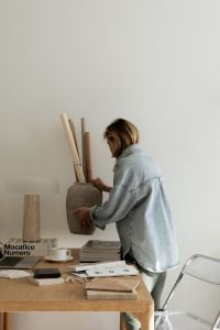 Kaboompics - Designer Styling Decorative Branches in a Textured Vase at Studio Desk