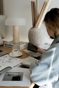 Kaboompics - Interior Design Workspace with Black Marble, Coffee and Concept Drawings