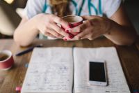 Kaboompics - Woman holding cup of coffee