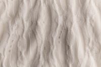 Kaboompics - Cream Knit Texture With Soft Sculpted Detail