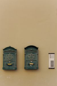 Kaboompics - Antique Cast-Iron Mailboxes on a Sun-Warmed Italian Facade