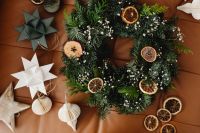 Kaboompics - Overhead Christmas Wreath with Paper Ornaments and Dried Orange