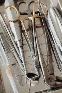 Professional Dental Instruments and Oral Surgery Tools on Neutral Background