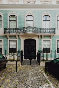 Kaboompics - Mint Azulejo-Tiled Lisbon Townhouse with Ornate Balcony and Black Door