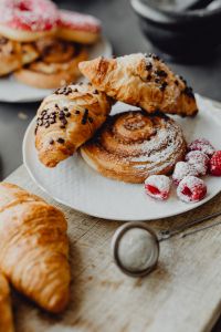 Kaboompics - Close-Up of Croissants and Cinnamon Buns with Raspberries