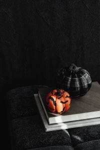 Kaboompics - Black Pumpkin and Halloween Decoration on Books