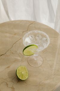 Kaboompics - Clear Lime Cocktail on a Stone Table