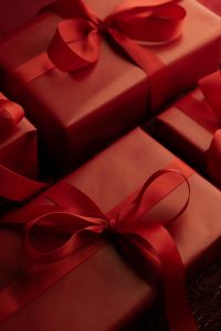 Kaboompics - Red Presents with Burgundy Bows and Copy Space