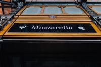 Kaboompics - Mozzarella Bar Sign on San Miguel Market Facade