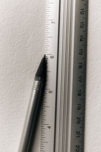 Kaboompics - Pencil Between Metal Rulers Close-Up