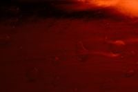 Kaboompics - Dark Red Wet Glass Texture Abstract Background