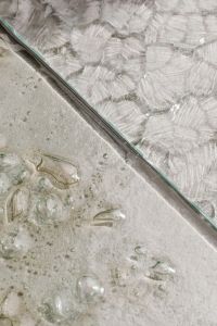 Kaboompics - Diagonal Glass Panel Edge over an Abstract Textured Surface