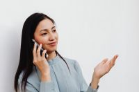 Kaboompics - Asian Woman Explaining Something During a Smartphone Call