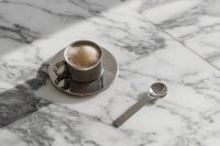 Kaboompics - Chrome Coffee Cup and Spoon on Arabescato Marble Table