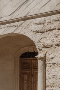 Kaboompics - White Limestone Arch with Wooden Door and Ornate Fanlight