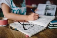 Kaboompics - Woman writing in her notebook