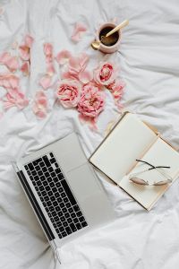 Kaboompics - Laptop, Open Planner and Eyeglasses with Pink Roses and Coffee