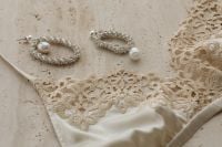 Kaboompics - Light Beige Lace Bra with Pearls and Silver Earrings
