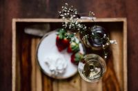 Kaboompics - Strawberries with cream and glass of white wine on wooden tray