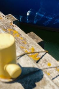 Kaboompics - Boat Hull Reflection on Calm Harbor Water