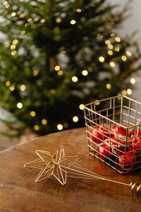 Kaboompics - Red Ornaments and Gold Star on a Wooden Table