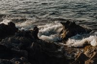 Kaboompics - White Waves Breaking Over Jagged Black Rocks