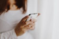 Kaboompics - Beautiful young woman using smartphone