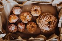 Kaboompics - Assorted Polish Pączki and Donuts in a Paper-Lined Box, Fat Thursday Food