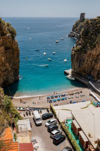 Kaboompics - Boats in a Rocky Amalfi Coast Cove Beneath a Coastal Tower