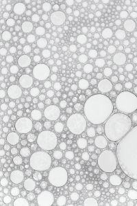 Kaboompics - White Abstract Liquid Bubble Texture with Large Foam Circles along the Right