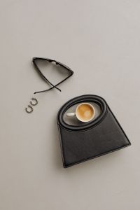 Kaboompics - Black Handbag with Espresso, Sunglasses and Silver Hoops
