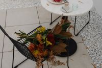 Kaboompics - Round Cafe Table with Croissant, Coffee and Autumn Bouquet