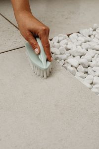 Kaboompics - Close-Up of Cleaning White Decorative Stones with a Brush