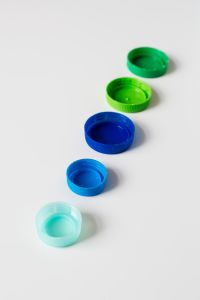 Kaboompics - Colorful Plastic Bottle Caps in a Vertical Line