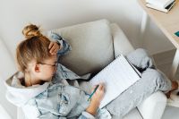 Kaboompics - Overhead View of Teenage Student Doing Homework
