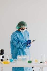 Kaboompics - Woman in Protective Gear at a Science Lab Bench