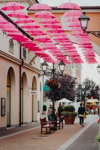 Kaboompics - Pink Umbrellas Hanging Above Designer Outlet Street